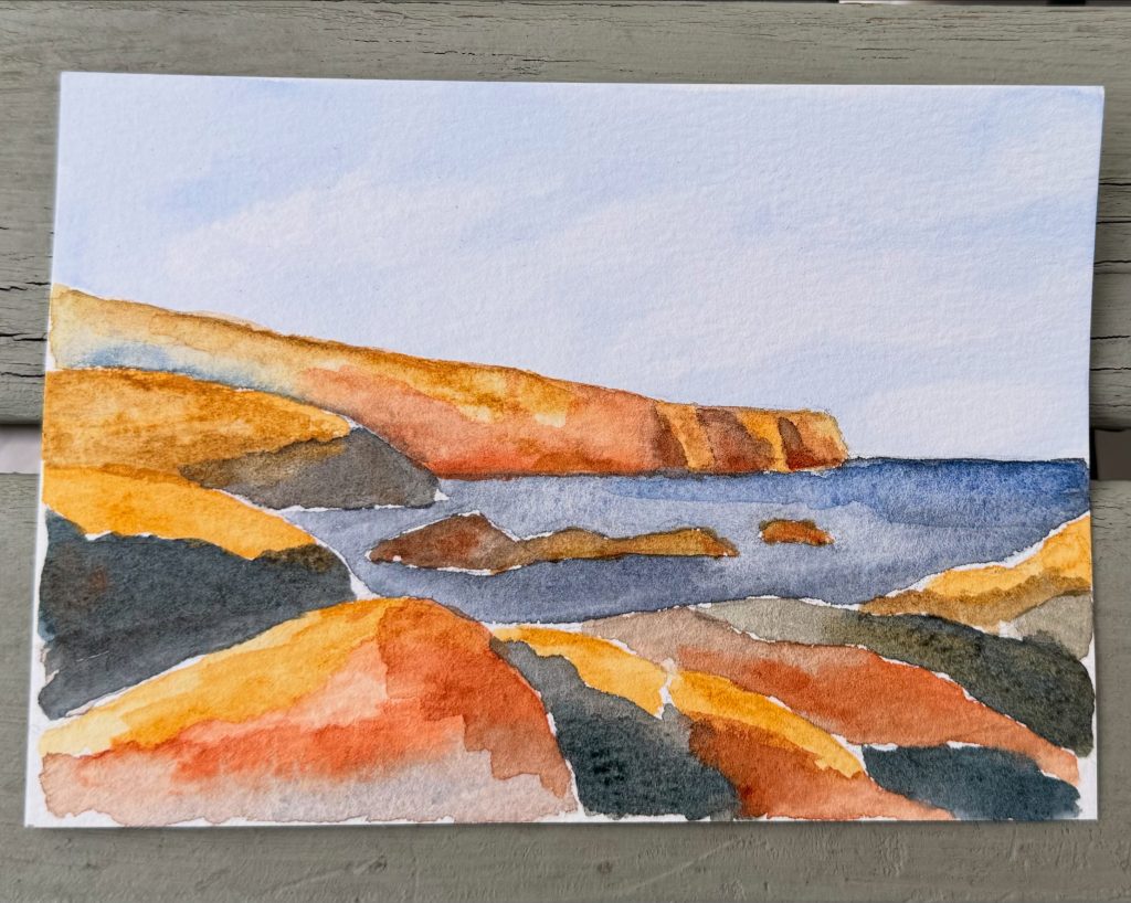 Photo of a Scottish seascape ostcard painting in watercolour